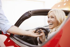 girl-receiving-keys-to-an-electric-car-108356531-57aaad255f9b58974a5d3d77